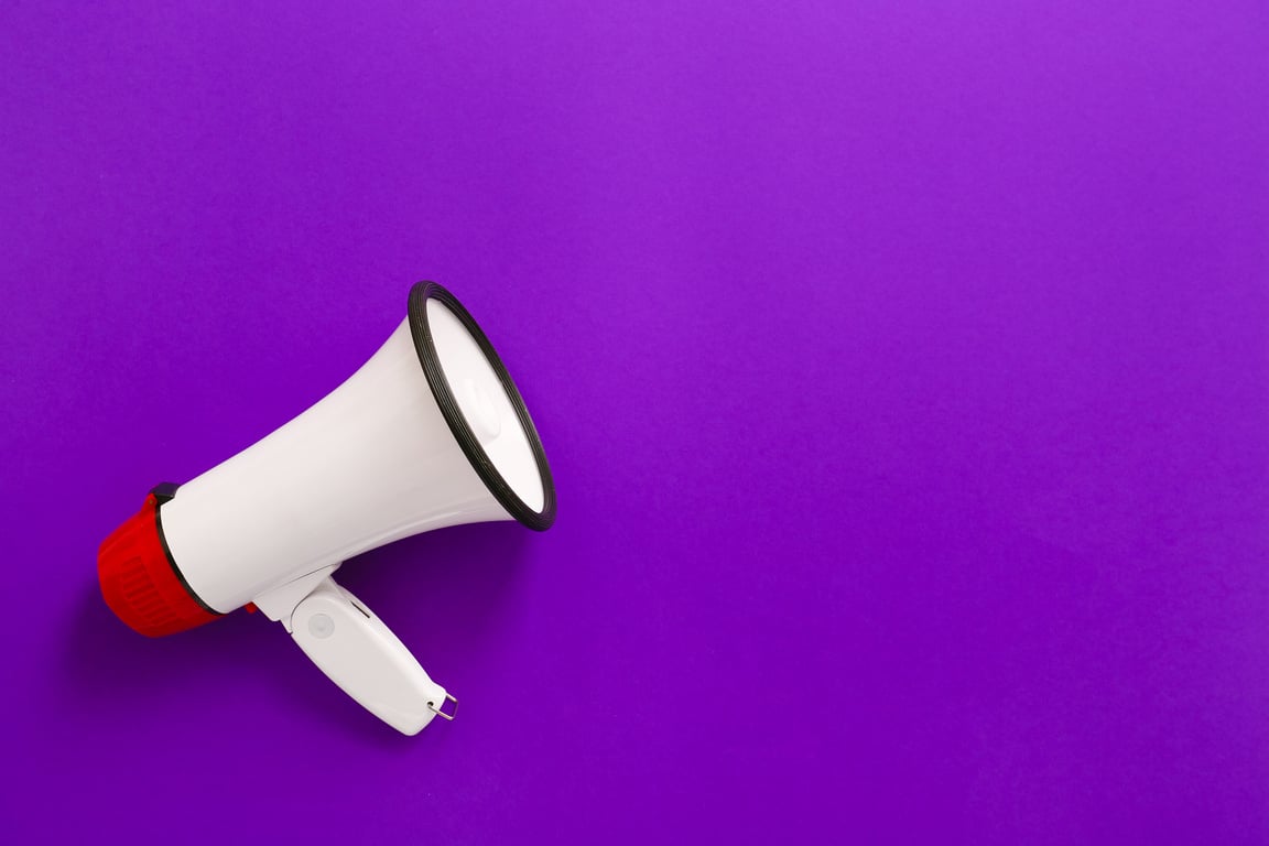 Megaphone on Color Purple Background